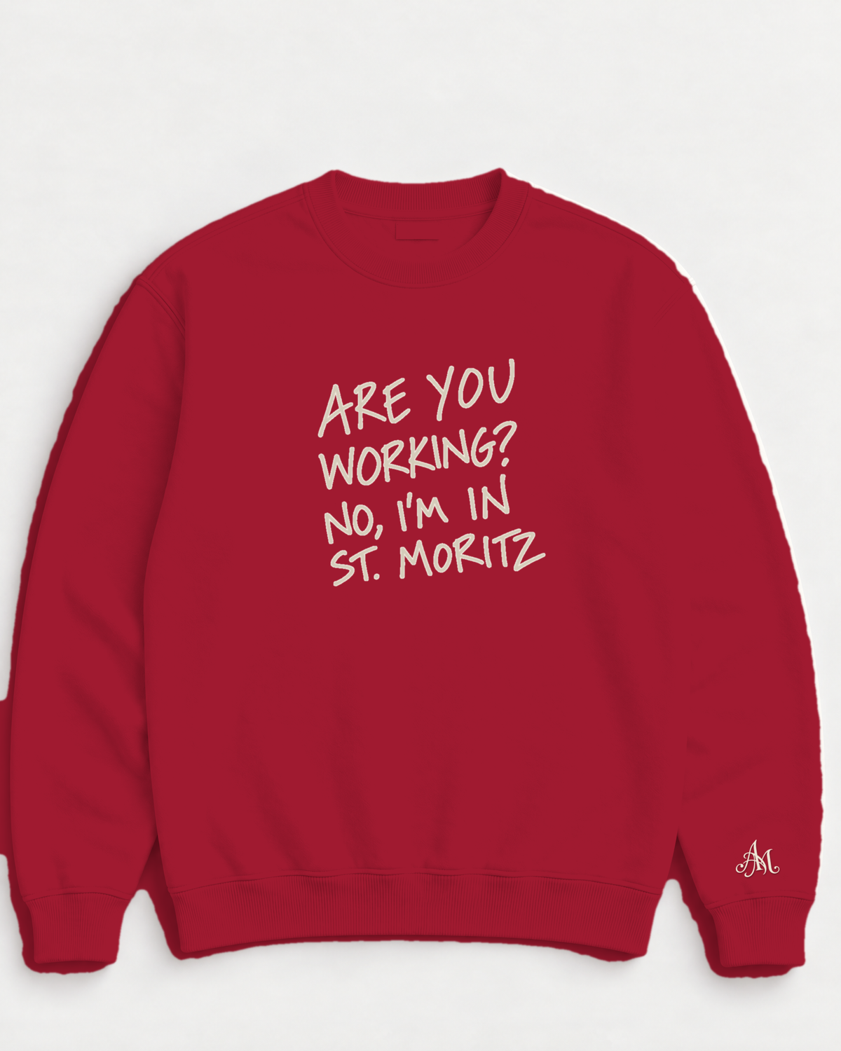Ruby Red crewneck sweatshirt with embroidered Are You Working? No, I'm In St. Moritz