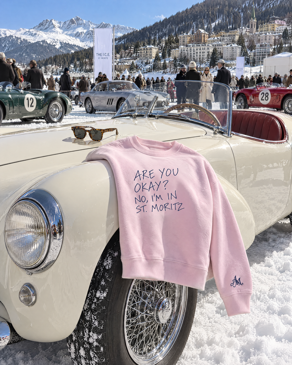Light pink crewneck on a vintage roadster at The I.C.E. St. Moritz