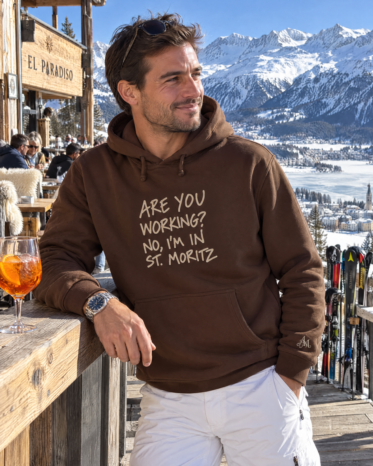 Chocolate brown hoodie Are You Working? on the El Paradiso terrace above St. Moritz